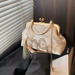 Gold kisslock clutch evening bag